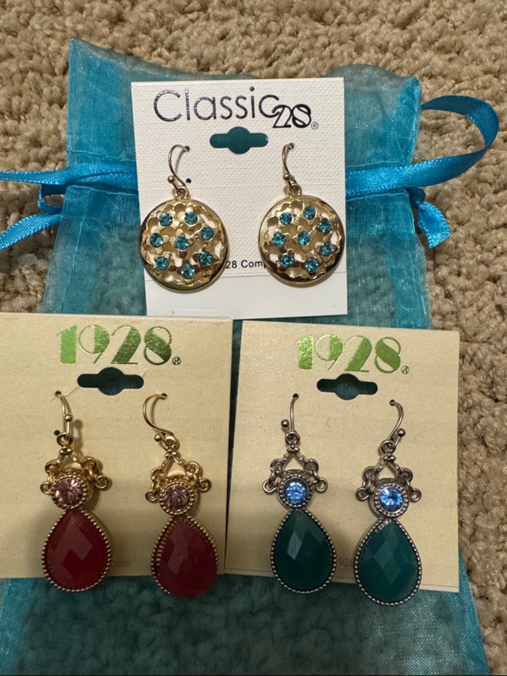 1928 and Classic 28 earrings.